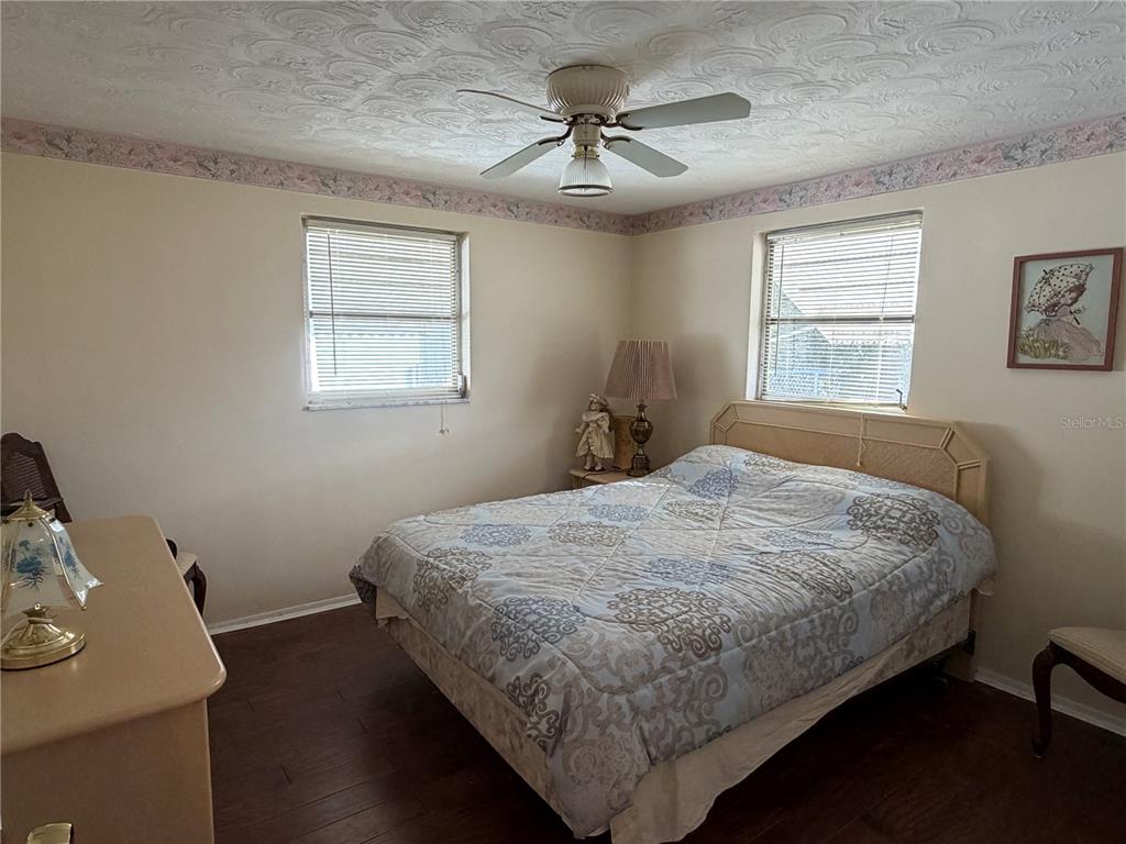 3914 Carioca Road Holiday, FL 34691 - Photo 16 of 23 a bedroom with a bed and a table in it