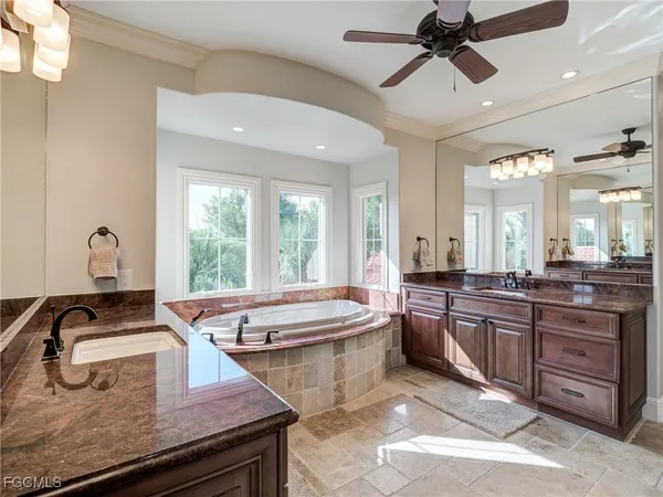 a kitchen with sink stove and view living room