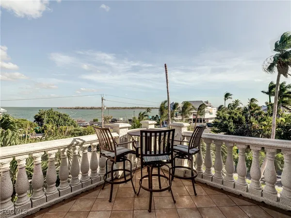 an outdoor view from balcony with furniture