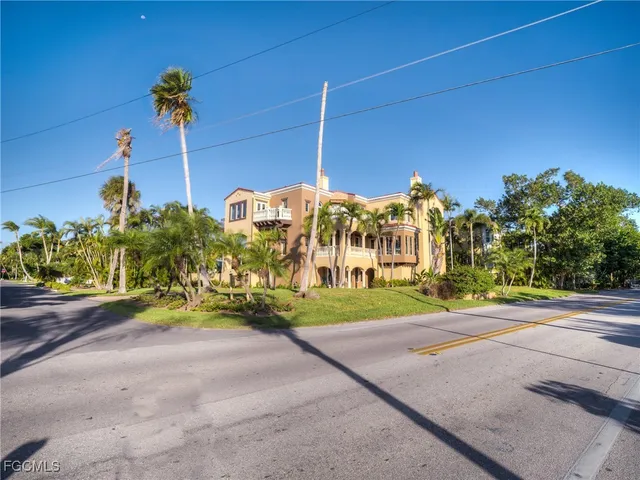 a view of a road with a building in the background
