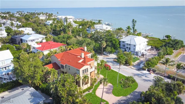 an aerial view of a houses with yard