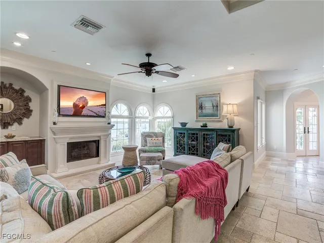 a living room with furniture fireplace and flat screen tv