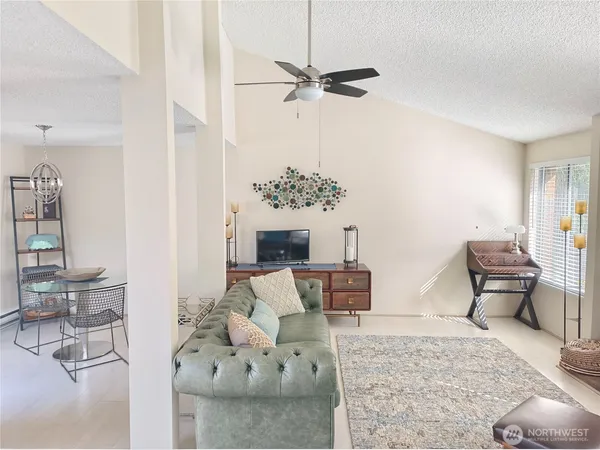 a living room with furniture and a table