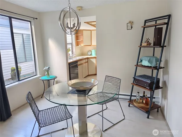 a dining room with furniture and window
