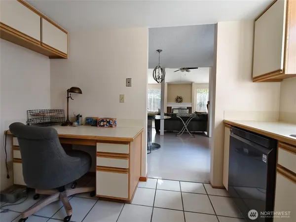 a kitchen with a sink cabinets and appliances