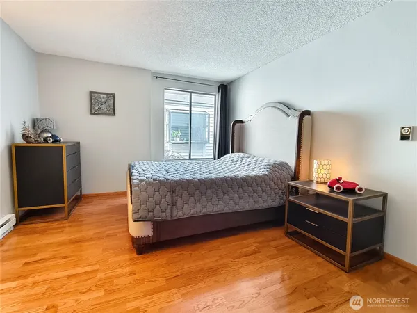 a bedroom with a bed and window