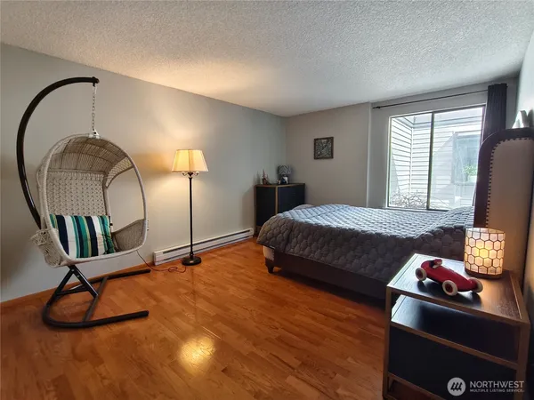 a bedroom with bed and a dresser