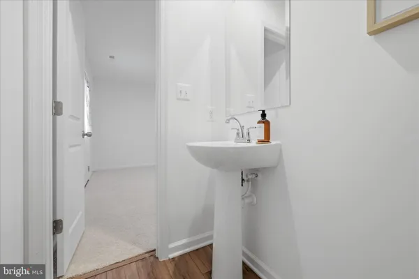 a bathroom with a sink a mirror and shower