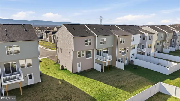 a aerial view of a house with swimming pool