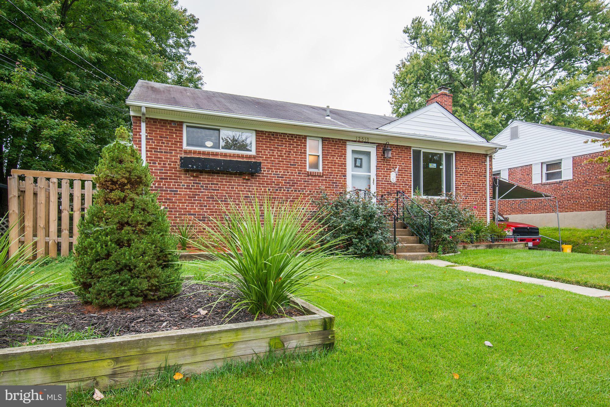 12510 Goodhill Road Silver Spring, MD 20906 - Photo 1 of 28 a front view of a house with a yard