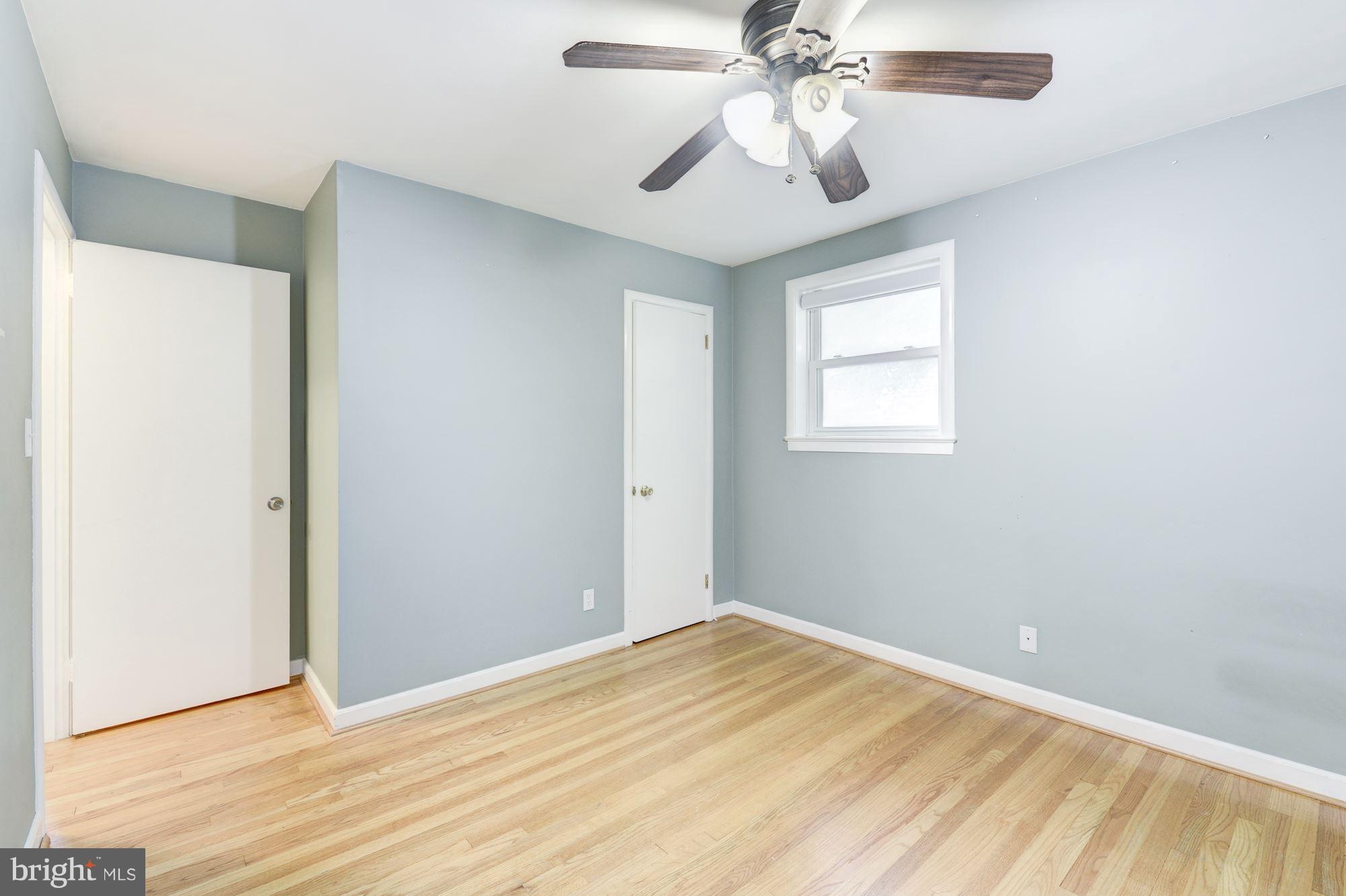 12510 Goodhill Road Silver Spring, MD 20906 - Photo 15 of 28 wooden floor in an empty room with a window