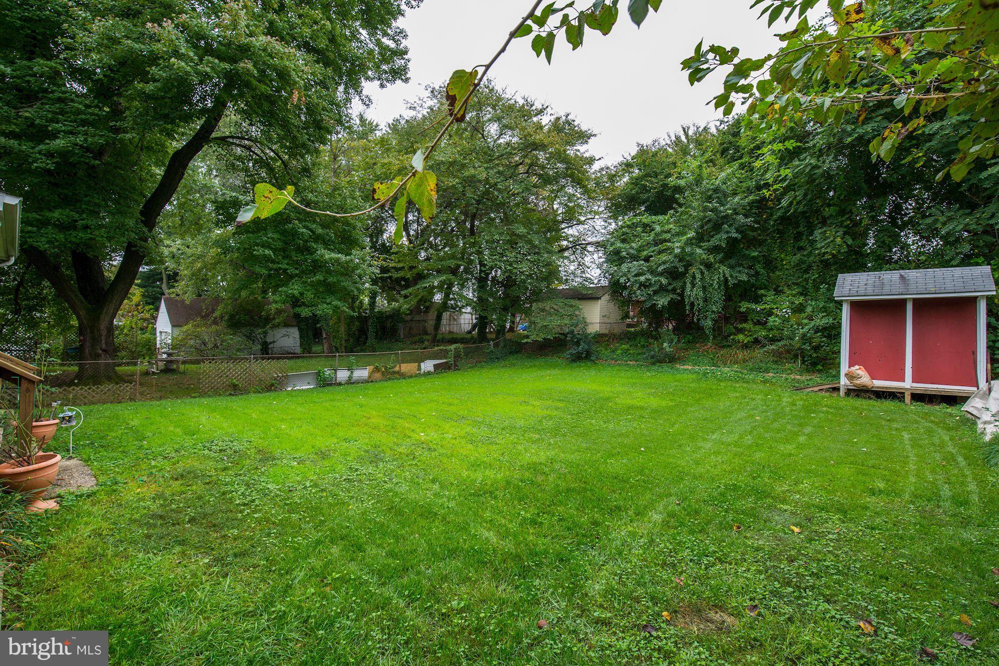12510 Goodhill Road Silver Spring, MD 20906 - Photo 28 of 28 a view of a backyard with a garden and entertaining space