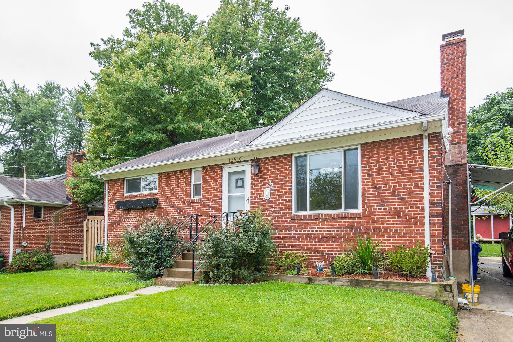 12510 Goodhill Road Silver Spring, MD 20906 - Photo 4 of 28 a front view of a house with garden