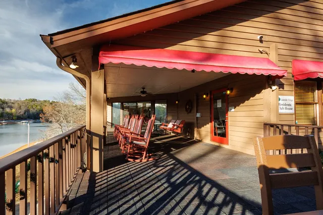 an aerial view of residential house with outdoor space and river
