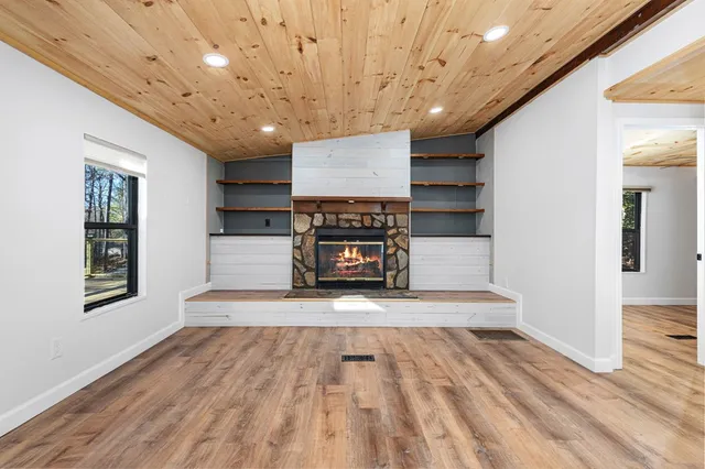 a hall with kitchen appliances and a couch