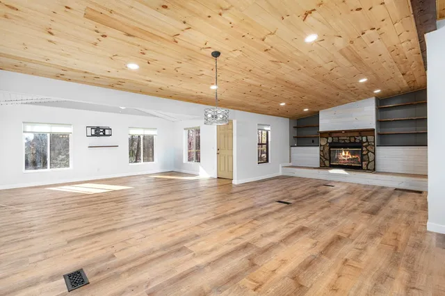 a view of a livingroom with furniture and a flat screen tv