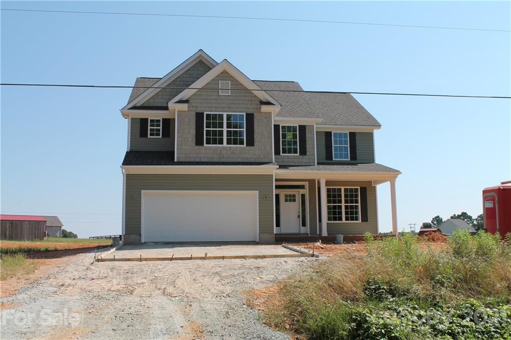 4721 Stack Road Monroe, NC 28112 - Photo 1 of 2 a front view of a house with a yard and garage
