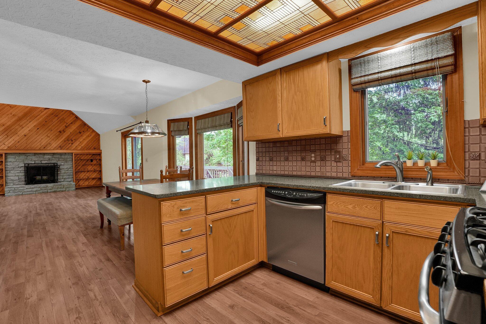 623 Rockbridge Road Westerville, OH 43081 - Photo 12 of 63 Well-appointed kitchen has stainless steel appliances, granite countertops and custom backsplash. Large double door pantry makes storing your snacks easy!