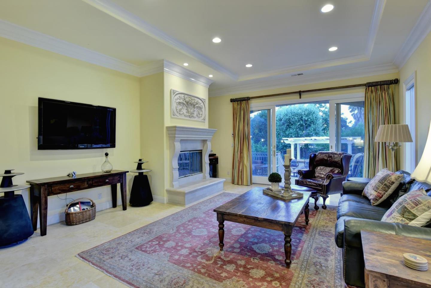 15867 Mina Way Saratoga, CA 95070 - Photo 15 of 43 a living room with furniture fireplace and flat screen tv