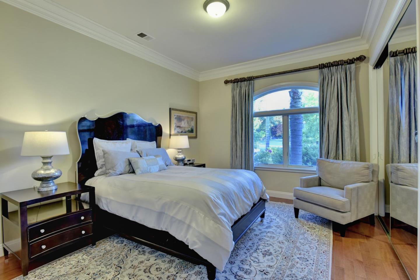 15867 Mina Way Saratoga, CA 95070 - Photo 23 of 43 a bedroom with a bed and a couch next to a window