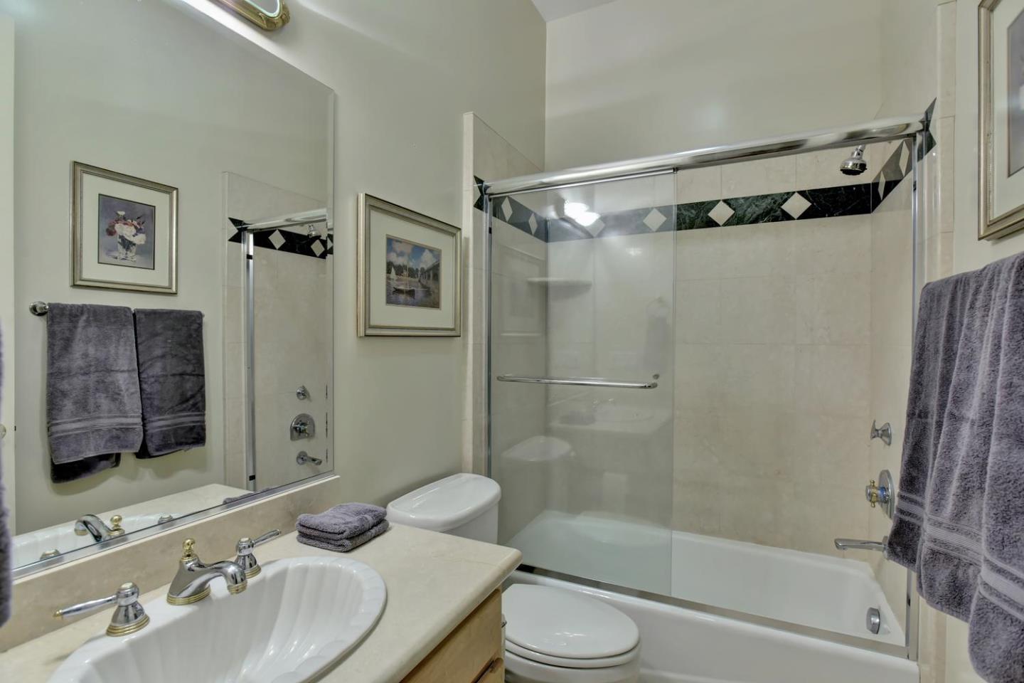 15867 Mina Way Saratoga, CA 95070 - Photo 24 of 43 a bathroom with a bathtub shower sink vanity and toilet