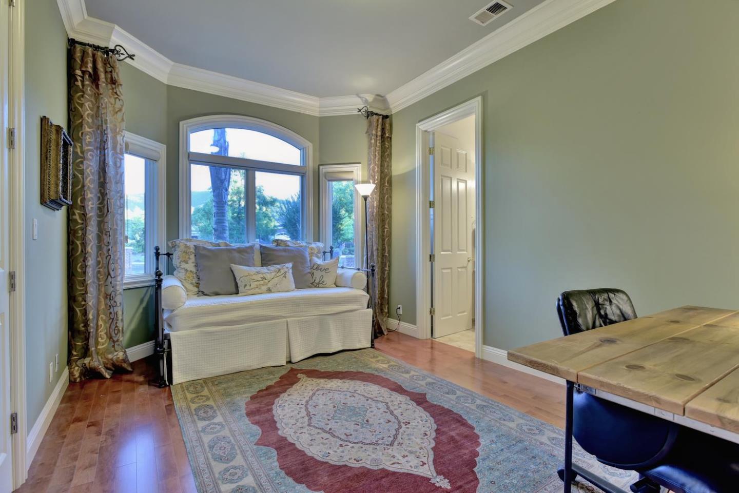 15867 Mina Way Saratoga, CA 95070 - Photo 27 of 43 a living room with furniture and a rug