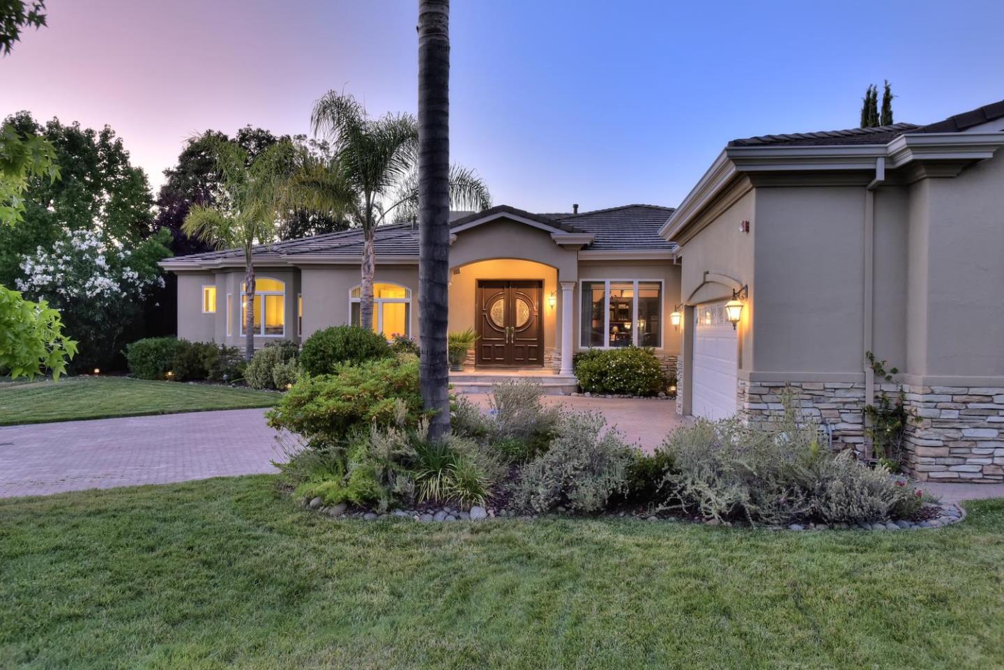 15867 Mina Way Saratoga, CA 95070 - Photo 3 of 43 a front view of a house with garden
