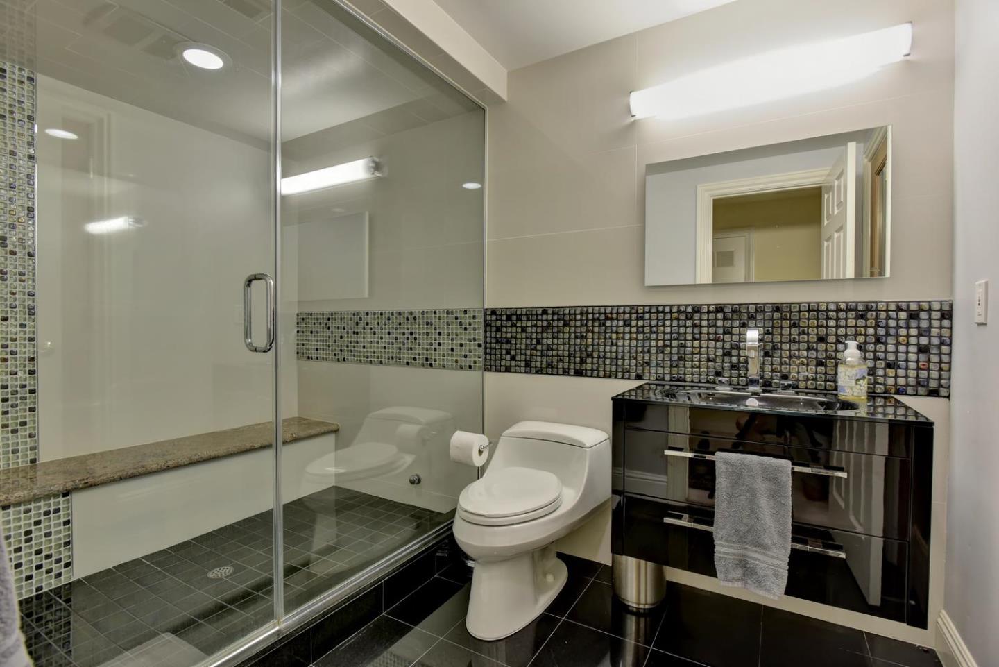 15867 Mina Way Saratoga, CA 95070 - Photo 36 of 43 a bathroom with a toilet sink and shower