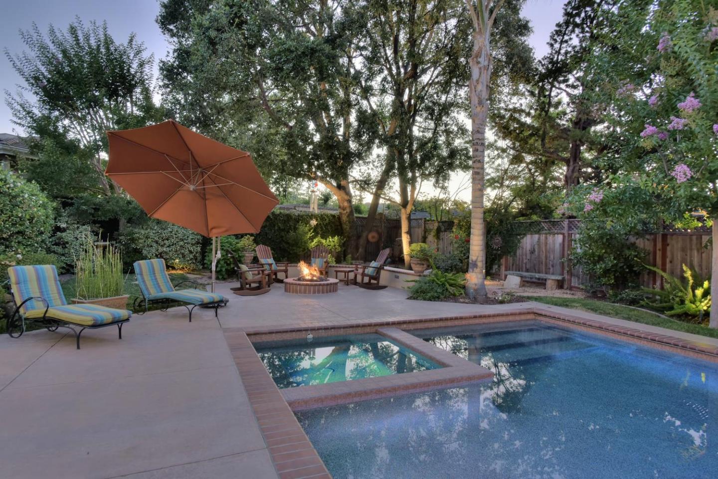 15867 Mina Way Saratoga, CA 95070 - Photo 40 of 43 a view of a backyard with chairs and a patio