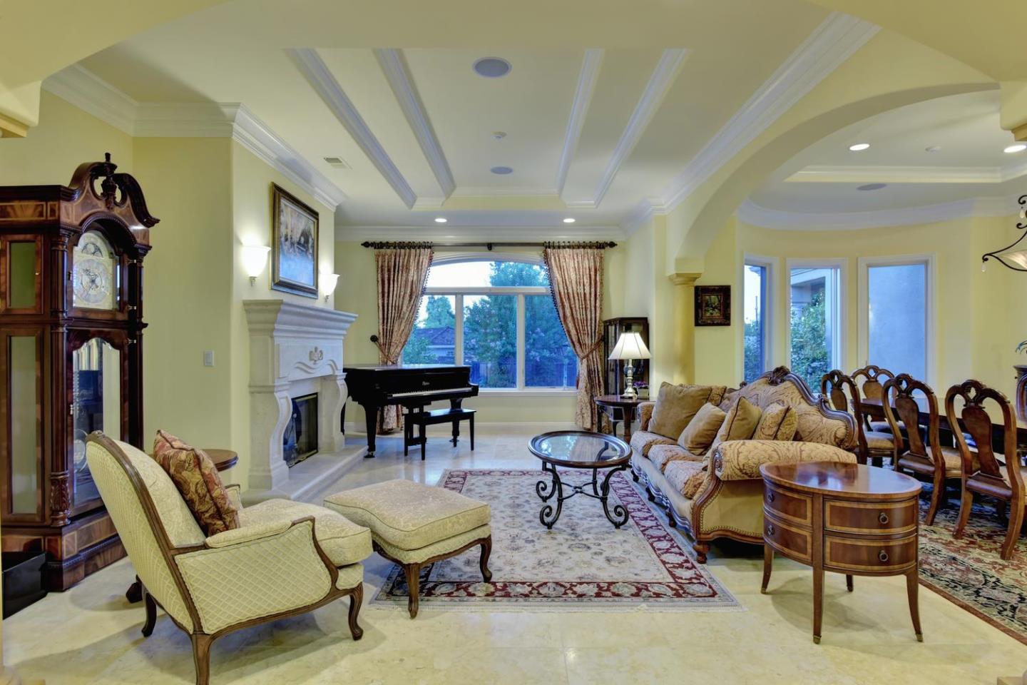 15867 Mina Way Saratoga, CA 95070 - Photo 10 of 43 a living room with furniture a window and gym equipment