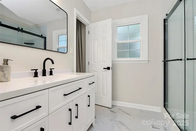 a bathroom with a sink and mirror