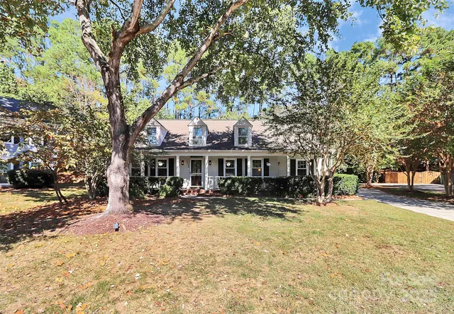 a view of a house with a yard covered with snow in the patio