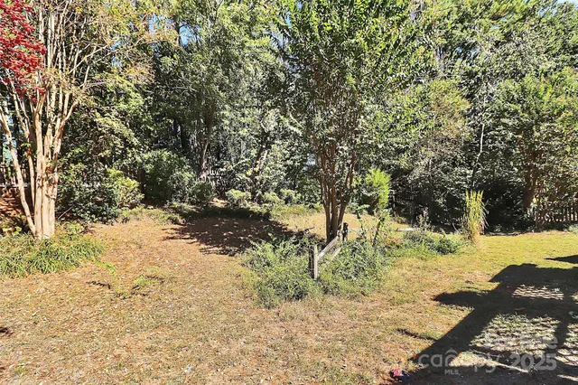 a view of a yard covered in snow