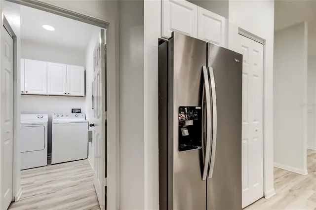 a bathroom with a sink mirror vanity and toilet