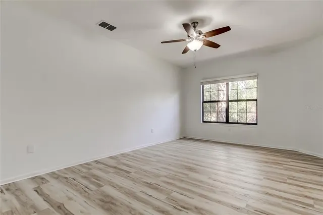 a bathroom with a sink vanity and a mirror