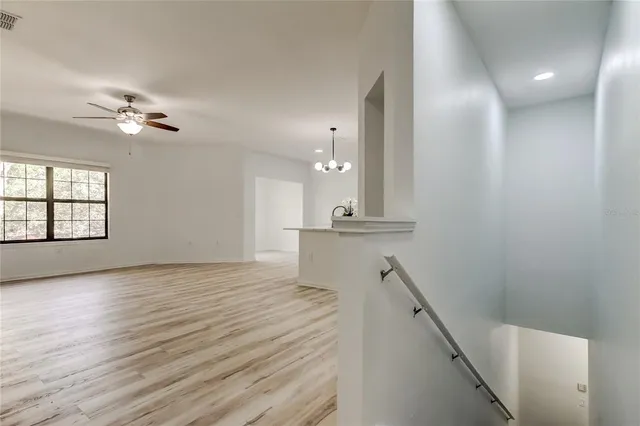 a kitchen with stainless steel appliances white cabinets and a stove top oven