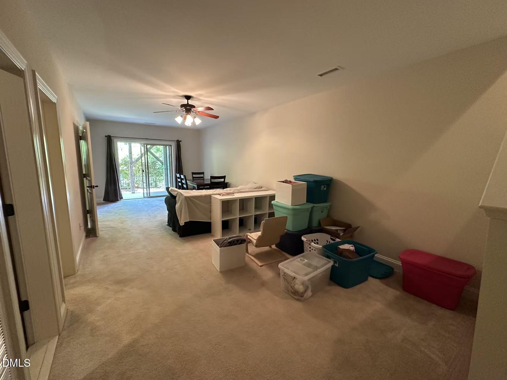 1056 Indigo Ridge Place Cary, NC 27519 - Photo 26 of 33 a room with furniture and a chandelier