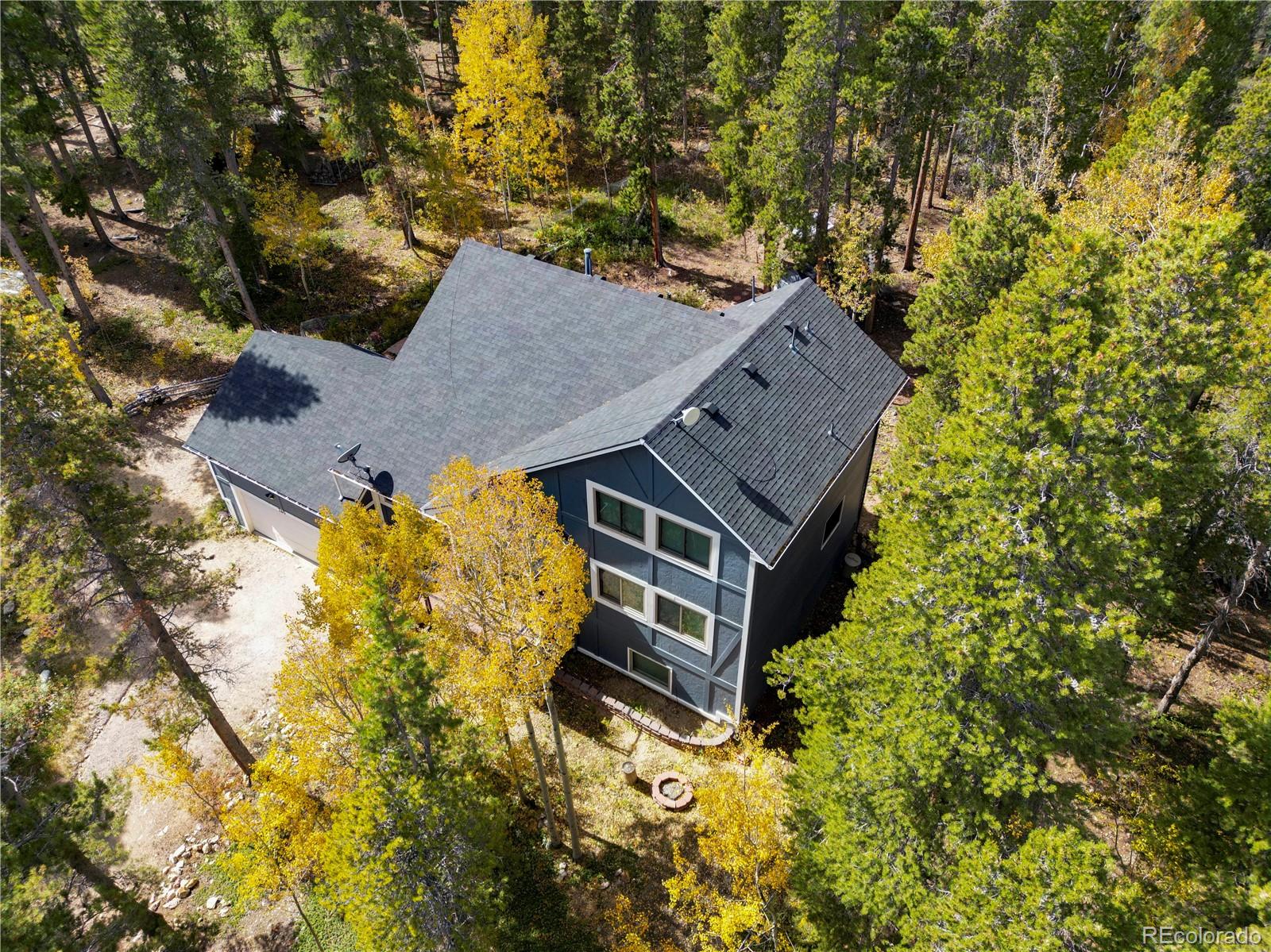 265 Caesar Road Black Hawk, CO 80422 - Photo 6 of 42 an aerial view of a house with a yard swimming pool and outdoor seating
