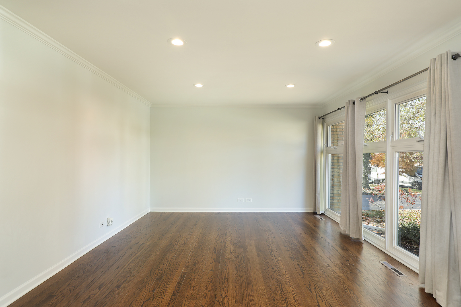 1913 Milton Avenue Northbrook, IL 60062 - Photo 15 of 24 an empty room with wooden floor and windows