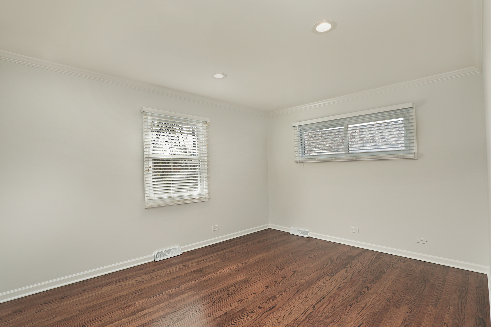 1913 Milton Avenue Northbrook, IL 60062 - Photo 19 of 24 a view of an empty room with wooden floor and a window