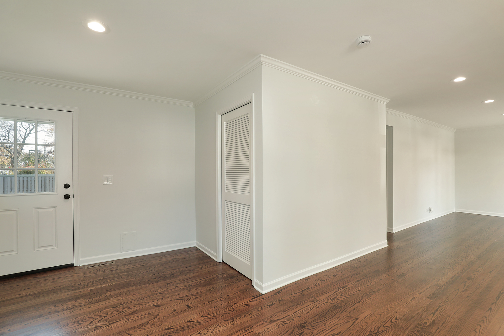 1913 Milton Avenue Northbrook, IL 60062 - Photo 20 of 24 a view of an empty room with wooden floor and windows