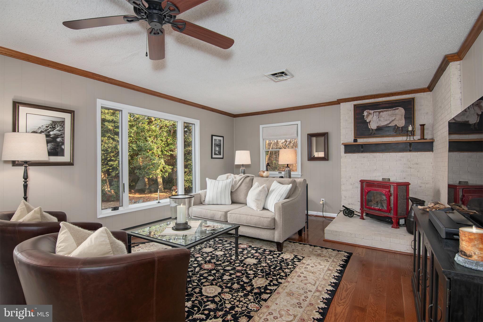 5529 Whitehall Road Cambridge, MD 21613 - Photo 17 of 41 a living room with furniture and a fireplace