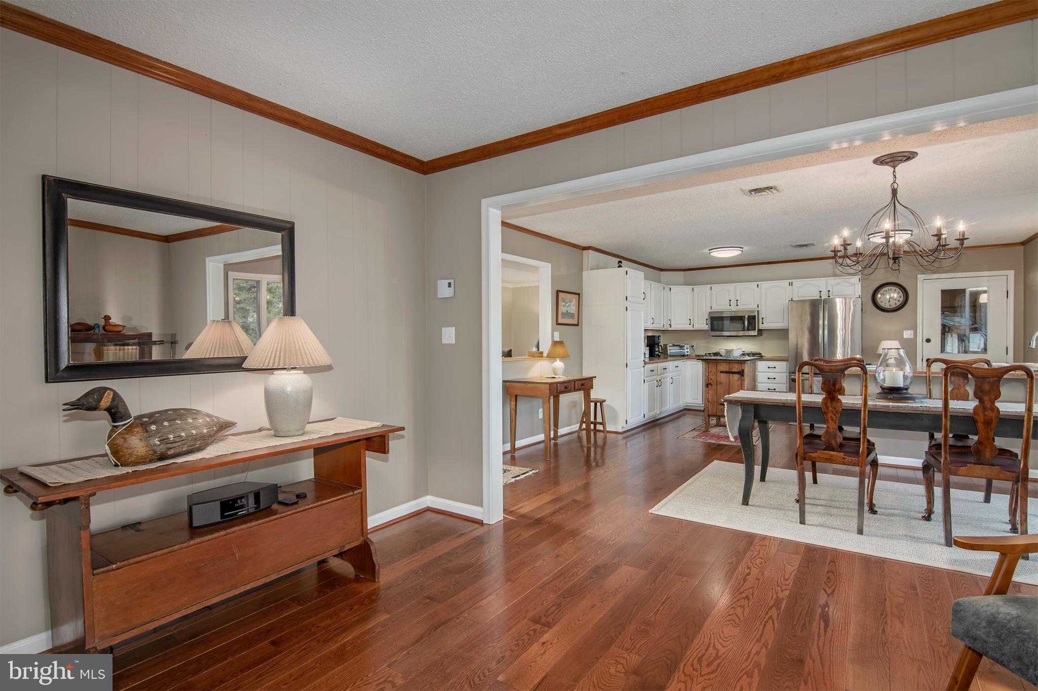 5529 Whitehall Road Cambridge, MD 21613 - Photo 21 of 41 a living room with furniture and a wooden floor