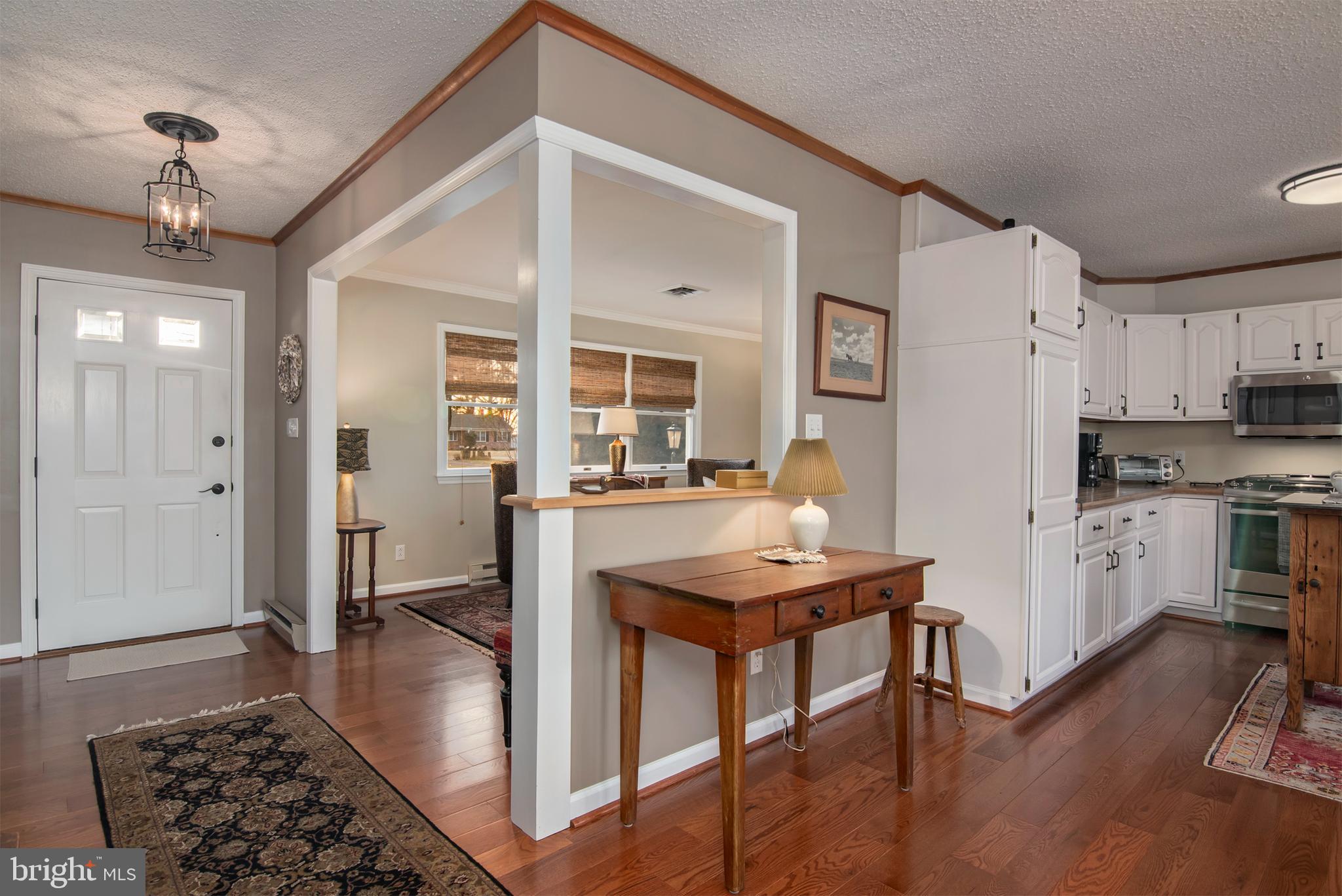 5529 Whitehall Road Cambridge, MD 21613 - Photo 23 of 41 a kitchen with stainless steel appliances granite countertop a refrigerator and a stove top oven