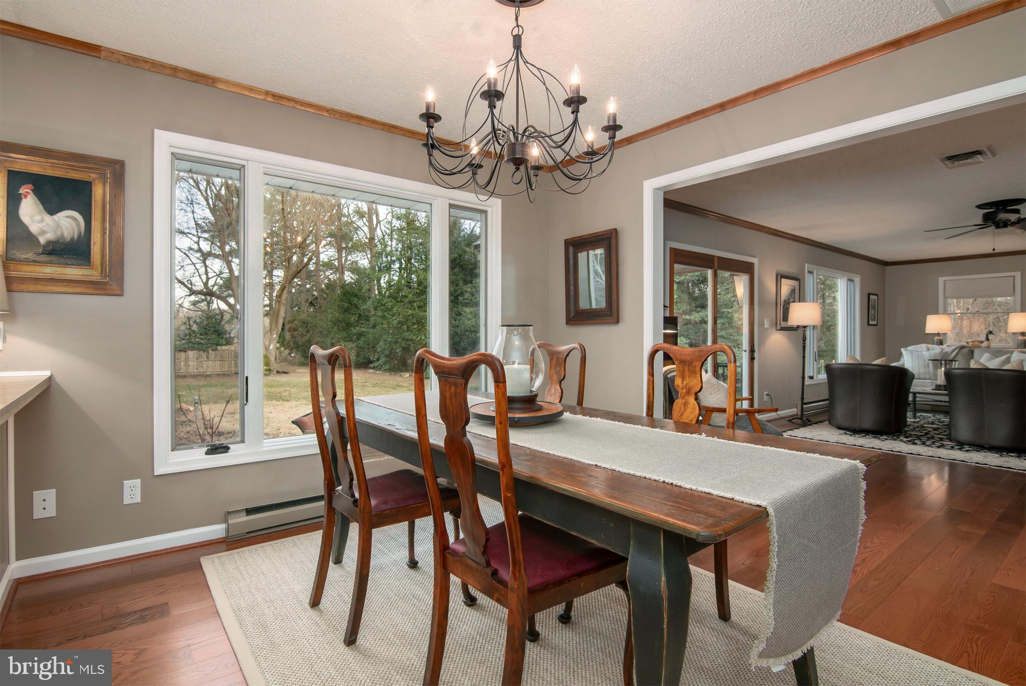 5529 Whitehall Road Cambridge, MD 21613 - Photo 25 of 41 a view of a dining room with furniture window and wooden floor