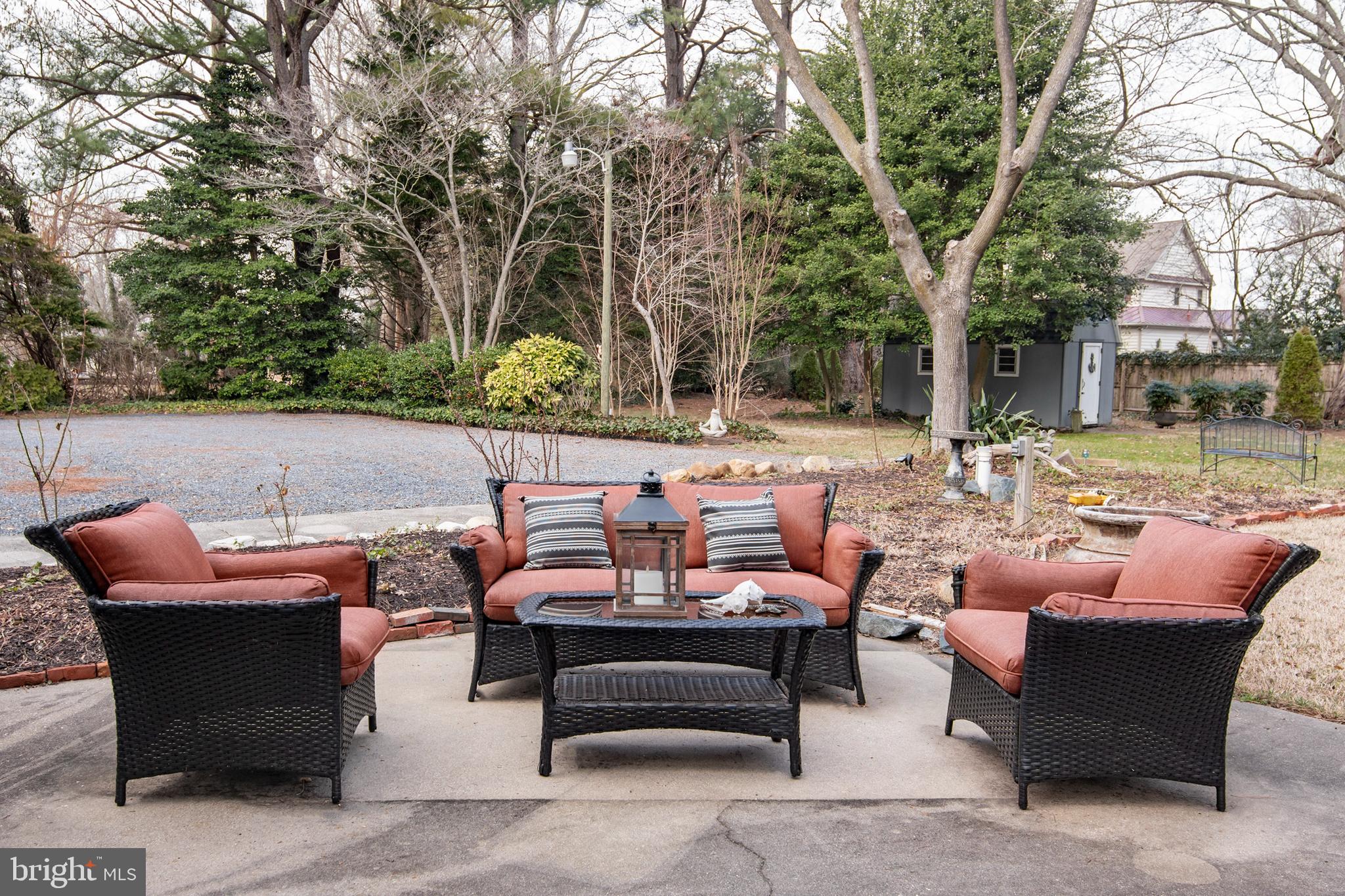 5529 Whitehall Road Cambridge, MD 21613 - Photo 9 of 41 a backyard of a house with fire pit and outdoor seating