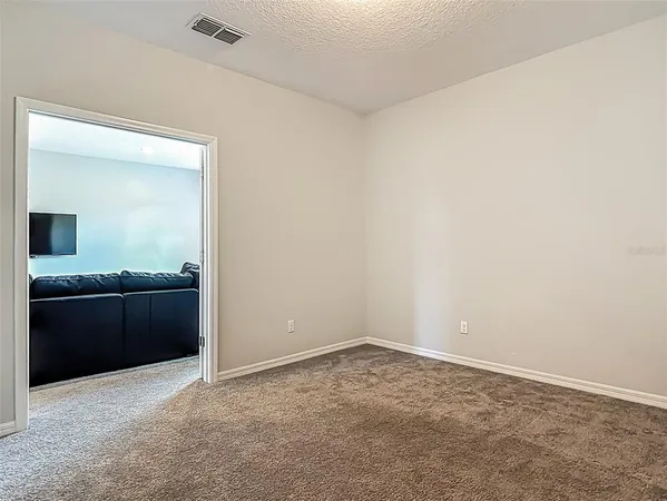 an empty room with a bathroom