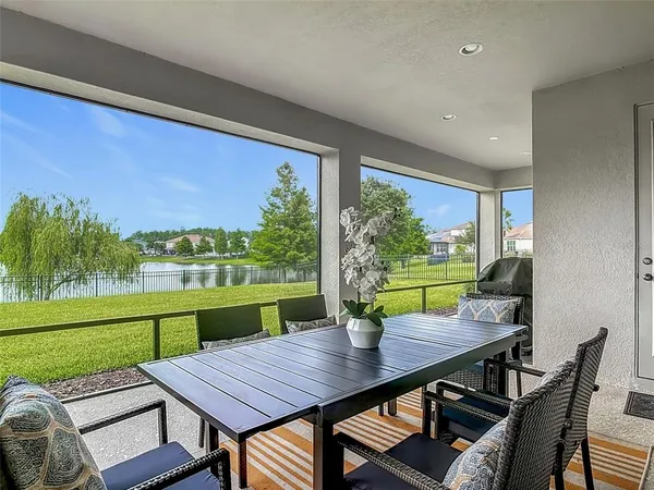 a view of a dining room with furniture window and outside view