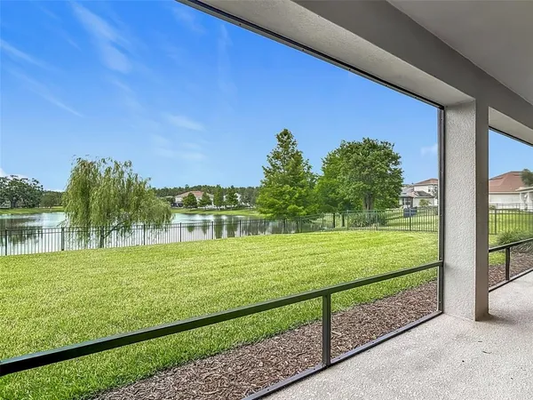 a view of a yard with an outdoor seating