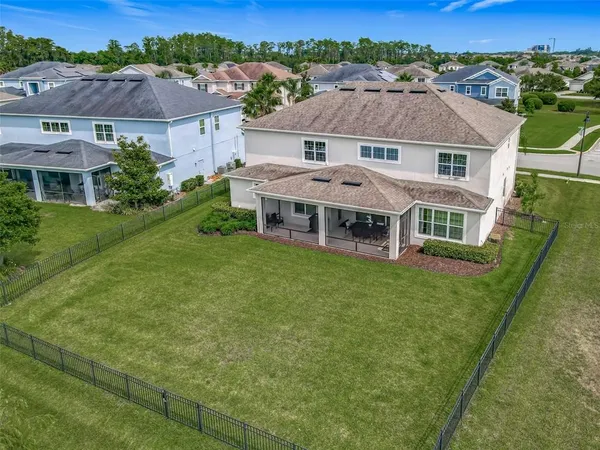 an aerial view of a house with a garden